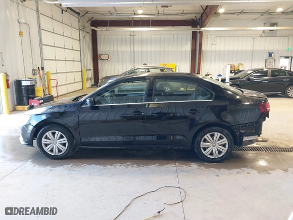 2017 Volkswagen Jetta 1.4T S with VIN 3VW167AJ5HM329706, listed as a IAAI auction lot 40801058 with 144,103 mi miles. Bid and sale history available at carsss.com. Image 15.