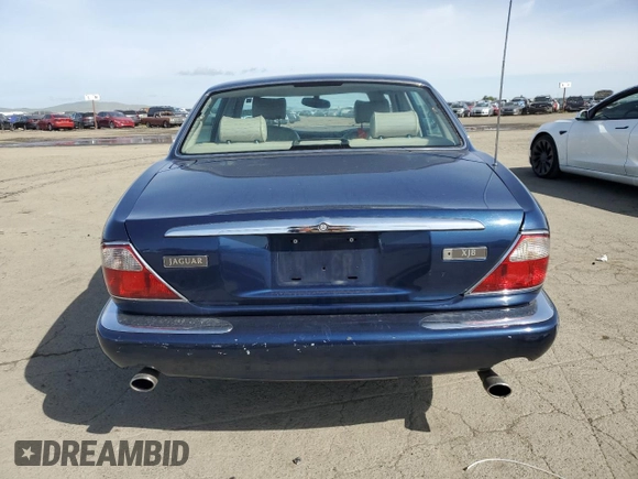 2000 Jaguar XJ with VIN SAJDA14C7YLF18873, listed as a Copart auction lot 50032495 with Not Provided miles and Salvage Title. Bid and sale history available at DreamBid. Image 6.