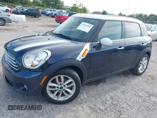 2013 MINI Countryman with VIN WMWZB3C5XDWM31035, listed as a IAAI auction lot 42543943 with 151,209 mi miles and . Bid and sale history available at DreamBid. Image 2.