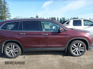 2016 Honda Pilot Touring with VIN 5FNYF6H99GB094933, listed as a IAAI auction lot 41967730 with 98,841 mi miles. Bid and sale history available at carsss.com. Image 13.