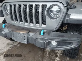 2021 Jeep Wrangler Unlimited Rubicon z VIN 1C4JJXR65MW675010, wystawiony jako IAAI lot #41990021 z przebiegiem 73 406 mil mil oraz . Historia ofert i sprzedaży dostępna na DreamBid. Obrazek 6.