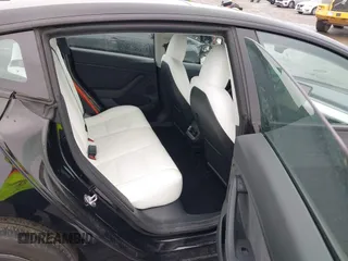 2023 Tesla Model 3 with VIN 5YJ3E1EA0PF587656, listed as a IAAI auction lot 41489586 with 12,844 mi miles and . Bid and sale history available at DreamBid. Image 8.