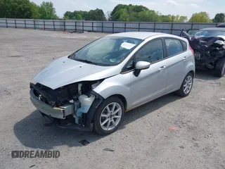 2019 Ford Fiesta SE z VIN 3FADP4EJ9KM107124, wystawiony jako IAAI lot #42067464 z przebiegiem 89 076 mil mil oraz . Historia ofert i sprzedaży dostępna na DreamBid. Obrazek 2.