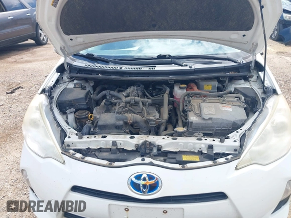 2012 Toyota Prius One z VIN JTDKDTB36C1009273, wystawiony jako IAAI lot #42454213 z przebiegiem 227 913 mil mil oraz . Historia ofert i sprzedaży dostępna na DreamBid. Obrazek 10.
