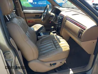 2000 Jeep Grand Cherokee Laredo z VIN 1J4G258S5YC237373, wystawiony jako IAAI lot #42736569 z przebiegiem 103 310 mil mil oraz . Historia ofert i sprzedaży dostępna na DreamBid. Obrazek 5.