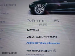 2013 Tesla Model S with VIN 5YJSA1CN7DFP26335, listed as a IAAI auction lot 41529752 with 247,789 mi miles. Bid and sale history available at carsss.com. Image 7.