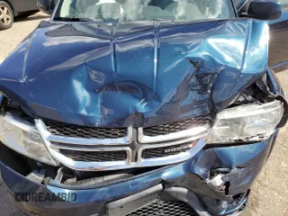 2013 Dodge Journey SXT with VIN 3C4PDCCG1DT637534, listed as a Copart auction lot 56992205 with 128,531 mi miles and Clean title. Bid and sale history available at DreamBid. Image 12.