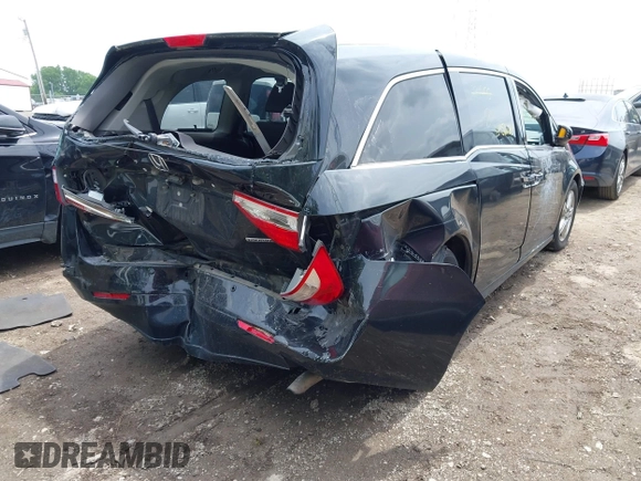 2012 Honda Odyssey Touring with VIN 5FNRL5H91CB121950, listed as a IAAI auction lot 42456620 with 200,831 mi miles and . Bid and sale history available at DreamBid. Image 4.