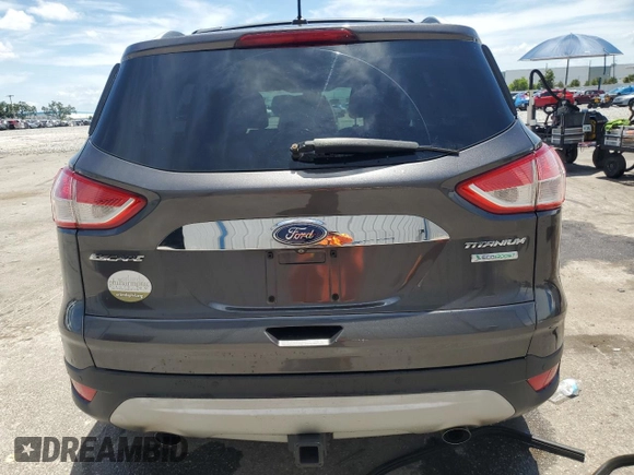 2015 Ford Escape Titanium z VIN 1FMCU0J98FUB06577, wystawiony jako Copart lot #61341175 z przebiegiem 66 206 mil mil oraz Szkoda całkowita • Salvage title. Historia ofert i sprzedaży dostępna na DreamBid. Obrazek 6.
