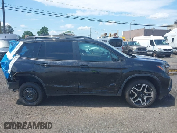 2023 Honda Passport Elite with VIN 5FNYF8H01PB030270, listed as a IAAI auction lot 42667744 with 7,931 mi miles and . Bid and sale history available at DreamBid. Image 13.