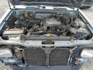 1993 Nissan Frontier SE z VIN 1N6HD16Y0PC408188, wystawiony jako Copart lot #71028394 z przebiegiem 258 939 mil mil oraz Szkoda całkowita • Salvage title. Historia ofert i sprzedaży dostępna na DreamBid. Obrazek 11.