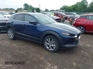 2022 Mazda CX-30 S Premium with VIN 3MVDMBDL0NM413545, listed as a IAAI auction lot 42493594 with 57,013 mi miles and . Bid and sale history available at DreamBid. Image 1.