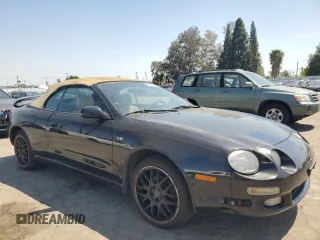 1997 Toyota Celica GT with VIN JT5FG02TXV0044202, listed as a Copart auction lot 52166575 with 167,292 mi miles and Salvage Title. Bid and sale history available at carsss.com. Image 4.