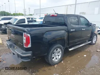 2015 GMC Canyon 2WD SLE with VIN 1GTG5BE3XF1226497, listed as a IAAI auction lot 42106960 with 97,360 mi miles and . Bid and sale history available at carsss.com. Image 4.