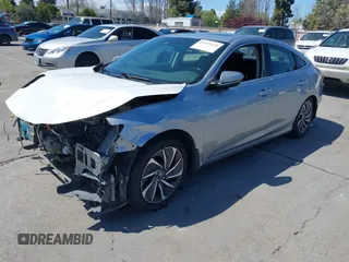 2019 Honda Insight Touring with VIN 19XZE4F93KE007489, listed as a IAAI auction lot 41943334 with 118,689 mi miles and . Bid and sale history available at DreamBid. Image 18.