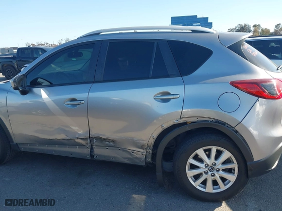 2013 Mazda CX-5 Touring with VIN JM3KE2CE3D0123138, listed as a IAAI auction lot 41818678 with 173,909 mi miles. Bid and sale history available at carsss.com. Image 14.