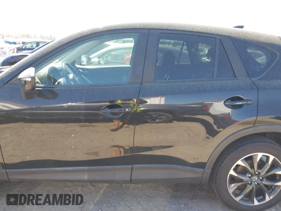 2016 Mazda CX-5 Grand Touring with VIN JM3KE4DY9G0893174, listed as a IAAI auction lot 41887814 with 79,811 mi miles. Bid and sale history available at carsss.com. Image 13.