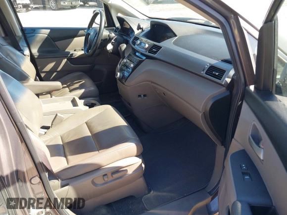 2012 Honda Odyssey Touring with VIN 5FNRL5H9XCB077351, listed as a IAAI auction lot 42045976 with 146,290 mi miles and . Bid and sale history available at DreamBid. Image 5.