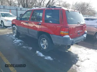1996 Jeep Grand Cherokee Laredo with VIN 1J4GZ58Y8TC374929, listed as a IAAI auction lot 41725111 with 196,723 mi miles. Bid and sale history available at carsss.com. Image 3.