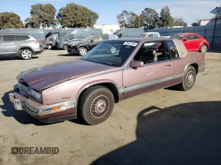 1988 Cadillac Eldorado with VIN 1G6EL1153JU632470, listed as a Copart auction lot 78507684 with 176,894 mi miles and Salvage Title. Bid and sale history available at DreamBid. Image 1.