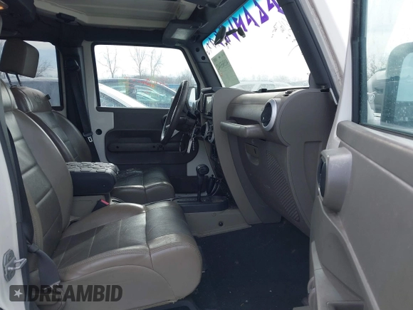 2010 Jeep Wrangler Unlimited Sahara with VIN 1J4HA5H19AL177179, listed as a IAAI auction lot 41565342 with 181,392 mi miles. Bid and sale history available at carsss.com. Image 5.
