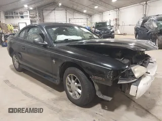 1997 Ford Mustang with VIN 1FALP4041VF157548, listed as a IAAI auction lot 39894591 with 146,891 mi miles. Bid and sale history available at carsss.com. Image 1.