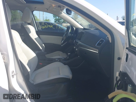 2016 Mazda CX-5 Grand Touring with VIN JM3KE4DY1G0680431, listed as a IAAI auction lot 42136637 with 166,348 mi miles. Bid and sale history available at carsss.com. Image 5.