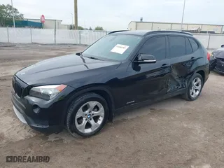 2014 BMW X1 sDrive28i with VIN WBAVM1C54EVW46561, listed as a IAAI auction lot 41880387 with 125,096 mi miles. Bid and sale history available at carsss.com. Image 17.