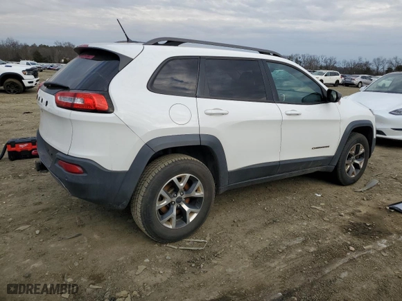 2015 Jeep Cherokee Trailhawk with VIN 1C4PJMBB1FW528766, listed as a Copart auction lot 46879355 with 248,676 mi miles and Salvage Title. Bid and sale history available at carsss.com. Image 3.