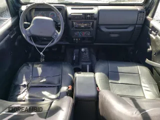 2002 Jeep Wrangler Sport with VIN 1J4FA49S92P715480, listed as a Copart auction lot 55157545 with 153,560 mi miles and Clean Title. Bid and sale history available at carsss.com. Image 9.