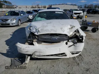 2007 Ford Taurus SE z VIN 1FAFP53U47A169014, wystawiony jako Copart lot #51858765 z przebiegiem Nie podano mil oraz Szkody całkowita. Historia ofert i sprzedaży dostępna na DreamBid. Obrazek 5.