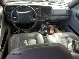 1999 Dodge Durango z VIN 1B4HS28Z3XF645192, wystawiony jako Copart lot #51225145 z przebiegiem Nie podano mil oraz Czysty tytuł • Clean title. Historia ofert i sprzedaży dostępna na DreamBid. Obrazek 8.
