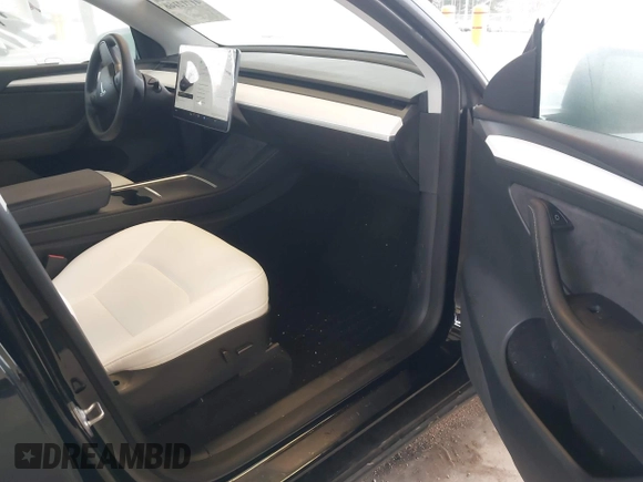 2023 Tesla Model Y Long Range with VIN 7SAYGAEEXPF707503, listed as a IAAI auction lot 41712166 with 27,467 mi miles and . Bid and sale history available at carsss.com. Image 5.