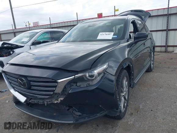 2018 Mazda CX-9 Grand Touring with VIN JM3TCADY3J0205878, listed as a IAAI auction lot 42178507 with 243,703 mi miles and . Bid and sale history available at DreamBid. Image 2.