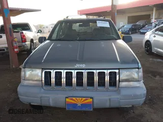 1998 Jeep Grand Cherokee Laredo with VIN 1J4GZ58S9WC136684, listed as a IAAI auction lot 41444103 with 1 mi miles. Bid and sale history available at carsss.com. Image 11.