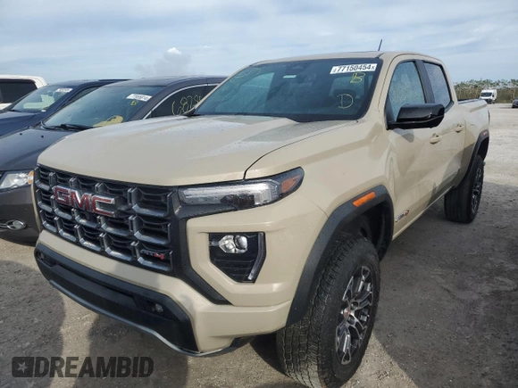 2023 GMC Canyon 4WD AT4 with VIN 1GTP6DEK3P1151112, listed as a Copart auction lot 77150454 with 5,573 mi miles and Non Repairable. Bid and sale history available at carsss.com. Image 1.