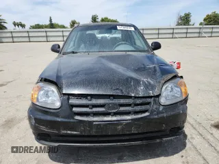 2003 Hyundai Accent GL z VIN KMHCG35C33U258812, wystawiony jako Copart lot #57509245 z przebiegiem 153 716 mil mil oraz Szkoda całkowita • Salvage title. Historia ofert i sprzedaży dostępna na DreamBid. Obrazek 5.