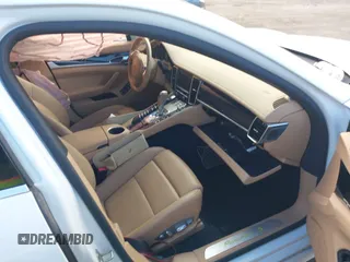 2014 Porsche Panamera S E-Hybrid with VIN WP0AD2A76EL044722, listed as a IAAI auction lot 40716615 with 52,474 mi miles and . Bid and sale history available at DreamBid. Image 5.