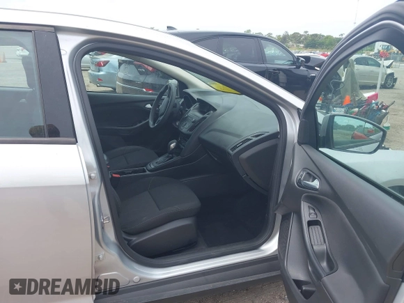 2018 Ford Focus SE z VIN 1FADP3FE4JL214013, wystawiony jako IAAI lot #42180138 z przebiegiem 72 550 mil mil oraz . Historia ofert i sprzedaży dostępna na DreamBid. Obrazek 5.