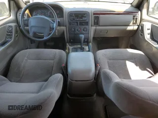 2000 Jeep Grand Cherokee Laredo with VIN 1J4G248S6YC333068, listed as a Copart auction lot 54972765 with 183,775 mi miles and Clean title. Bid and sale history available at DreamBid. Image 8.