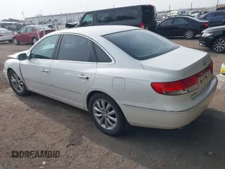 2007 Hyundai Azera SE with VIN KMHFC46F07A139369, listed as a IAAI auction lot 41999327 with 145,827 mi miles and . Bid and sale history available at DreamBid. Image 3.
