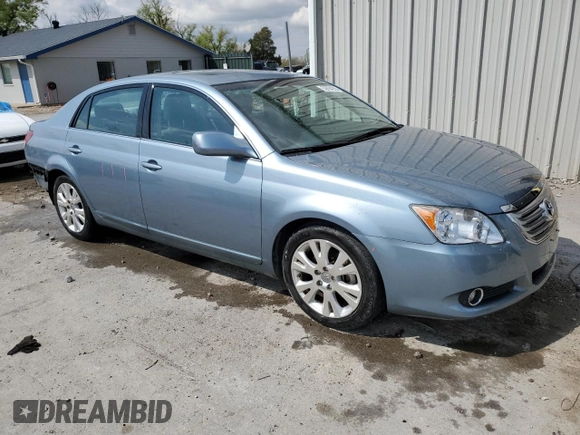 2010 Toyota Avalon XL with VIN 4T1BK3DB3AU357047, listed as a Copart auction lot 52694255 with 130,749 mi miles and Salvage Title. Bid and sale history available at carsss.com. Image 4.