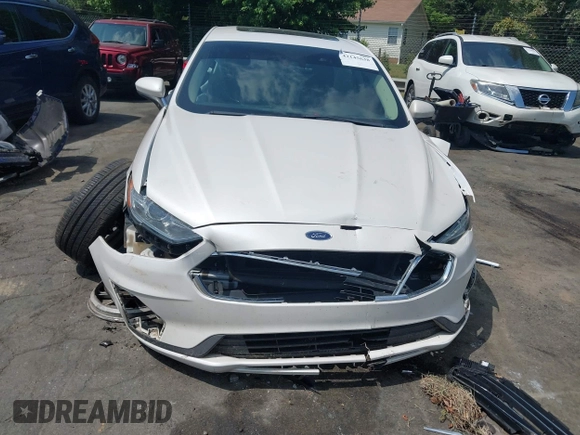 2020 Ford Fusion SE z VIN 3FA6P0LU5LR153942, wystawiony jako IAAI lot #42145638 z przebiegiem 99 961 mil mil oraz . Historia ofert i sprzedaży dostępna na DreamBid. Obrazek 12.