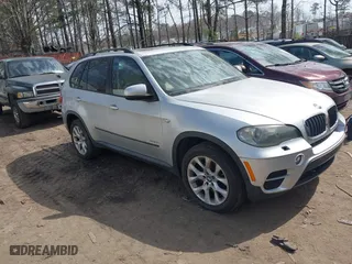 2011 BMW X5 35i with VIN 5UXZV4C53BL403476, listed as a IAAI auction lot 41820844 with 104,472 mi miles. Bid and sale history available at carsss.com. Image 1.