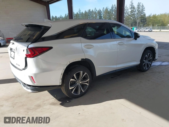 2021 Lexus RX with VIN JTJHZKFA2M2030841, listed as a IAAI auction lot 42009263 with 38,113 mi miles. Bid and sale history available at carsss.com. Image 4.