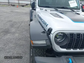 2024 Jeep Wrangler Rubicon with VIN 1C4RJXR61RW224506, listed as a IAAI auction lot 42111434 with 33,689 mi miles and . Bid and sale history available at DreamBid. Image 6.