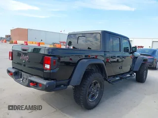 2021 Jeep Gladiator Rubicon z VIN 1C6JJTBG6ML535939, wystawiony jako IAAI lot #42260764 z przebiegiem 114 060 mil mil oraz . Historia ofert i sprzedaży dostępna na DreamBid. Obrazek 4.