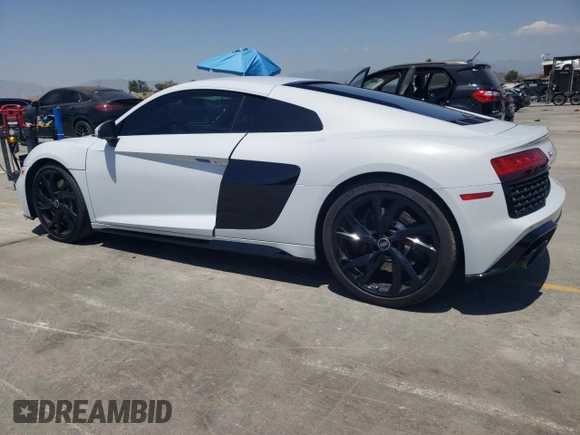 2023 Audi R8 performance quattro z VIN WUACEAFX9P7900103, wystawiony jako Copart lot #57456835 z przebiegiem 5 220 mil mil oraz Szkoda całkowita • Salvage title. Historia ofert i sprzedaży dostępna na DreamBid. Obrazek 2.