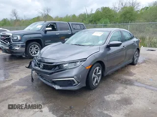 2019 Honda Civic LX with VIN 19XFC2F68KE007409, listed as a IAAI auction lot 41887406 with 57,147 mi miles and . Bid and sale history available at DreamBid. Image 2.