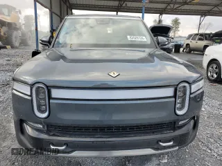 2023 Rivian R1S Launch Edition z VIN 7PDSGABL9PN022280, wystawiony jako Copart lot #83526124 z przebiegiem 51 mil mil oraz Szkoda całkowita • Salvage title. Historia ofert i sprzedaży dostępna na DreamBid. Obrazek 5.